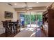 Dining area with bright sliding glass doors and views of the outdoor patio at 921 Tartan Dr # 31, Venice, FL 34293