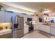 Bright kitchen with stainless steel appliances, white cabinets, and breakfast nook, perfect for Gathering meals at 921 Tartan Dr # 31, Venice, FL 34293