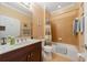 Bathroom featuring a tiled shower-tub combo, single vanity and light fixtures at 9839 Nostalgia Pl, Englewood, FL 34223