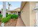 Inviting front entrance with a brick walkway, manicured landscaping, and decorative outdoor lighting at 9839 Nostalgia Pl, Englewood, FL 34223