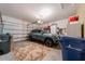 Spacious two-car garage featuring clean flooring and ample room for parking and storage at 9839 Nostalgia Pl, Englewood, FL 34223