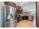 Beautiful kitchen features stainless steel appliances, dark cabinetry, and granite countertops at 9839 Nostalgia Pl, Englewood, FL 34223