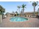 Beautiful community pool area with lounge chairs and lush greenery, providing a resort-like atmosphere at 9839 Nostalgia Pl, Englewood, FL 34223