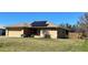 Inviting single-story home with solar panels, a two-car garage and a green front lawn at 1032 Mohawk Rd, Venice, FL 34293