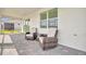 Covered patio featuring brick flooring and comfortable seating for outdoor relaxation at 10399 Abaco Falls Dr, Englewood, FL 34223