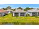 Home with a screened-in lanai overlooking a serene lake at 10399 Abaco Falls Dr, Englewood, FL 34223