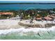Aerial view of property with private beach access, mature trees and a circular driveway at 1049 N Casey Key Rd, Osprey, FL 34229