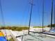 A sandy beach with catamarans lined up ready for a fun day on the water at 1049 N Casey Key Rd, Osprey, FL 34229