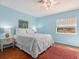 Bright bedroom featuring terracotta tile flooring, ceiling fan and queen-size bed at 1049 N Casey Key Rd, Osprey, FL 34229