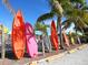 Assorted colorful kayaks displayed on lot, near palm trees at 1049 N Casey Key Rd, Osprey, FL 34229