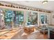 Bright and airy room with terracotta tile, views of the water and built-in shelf for art at 1049 N Casey Key Rd, Osprey, FL 34229