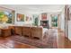 This bright living room features an expansive view of the tropical outdoors and comfortable seating at 1049 N Casey Key Rd, Osprey, FL 34229