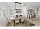 Bright dining room features modern lighting and neutral decor, perfect for entertaining at 10797 Tarflower Dr # 202, Venice, FL 34293