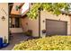 Inviting front entrance with brick pavers, landscaped bushes and flowers, and a welcoming doorway and sidelights at 10797 Tarflower Dr # 202, Venice, FL 34293