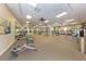 Large fitness center with state-of-the-art equipment, ample workout space, and natural light at 10797 Tarflower Dr # 202, Venice, FL 34293
