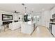 Open-concept living space with gourmet kitchen, and expansive island great for entertaining or cooking at 10797 Tarflower Dr # 202, Venice, FL 34293