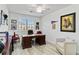 Office with wooden desk, natural light, and decor at 10797 Tarflower Dr # 202, Venice, FL 34293