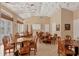 Large clubhouse with tables, chairs, and an American flag at 108 Corte Del Asolo, Venice, FL 34285