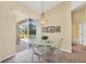 Cozy dining area adjacent to screened-in pool and patio area at 108 Corte Del Asolo, Venice, FL 34285
