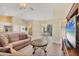 Open living area with tile flooring leading to a dining area and open kitchen at 108 Corte Del Asolo, Venice, FL 34285