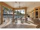 Inviting patio with ample seating, ceiling fans, and views of the sparkling community pool at 108 Corte Del Asolo, Venice, FL 34285