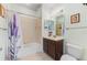 Bathroom boasting a shower-tub combo, single sink vanity, and neutral decor at 11157 Batello Dr, Venice, FL 34292