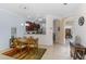 View of dining room with view to kitchen featuring tile flooring and modern lighting fixtures at 11157 Batello Dr, Venice, FL 34292