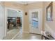 Spacious foyer featuring tile floors, with an office space visible to the left at 11157 Batello Dr, Venice, FL 34292