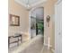 Elegant foyer with tile floors leads to the main living areas of the home at 11157 Batello Dr, Venice, FL 34292