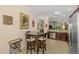 The eat-in kitchen features granite counters and stainless steel appliances at 11157 Batello Dr, Venice, FL 34292