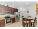 The eat-in kitchen has granite countertops and stainless steel appliances at 11157 Batello Dr, Venice, FL 34292