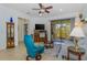 Bright living room with tile flooring, comfortable seating, and sliding glass doors to the lanai at 11157 Batello Dr, Venice, FL 34292