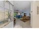 Open-concept living and dining area with tile flooring and ample natural light at 11157 Batello Dr, Venice, FL 34292