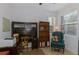 Office featuring a full desk with hutch and a comfortable chair with natural light at 11157 Batello Dr, Venice, FL 34292