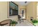 Cozy patio with seating area, ideal for relaxing and enjoying the outdoors at 11157 Batello Dr, Venice, FL 34292
