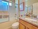 Bathroom features a tiled shower with glass door, granite counters, and modern fixtures at 117 Altesino Ct, Venice, FL 34292