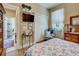 Comfortable bedroom with hardwood floors, closet space, and decorative accents at 117 Altesino Ct, Venice, FL 34292