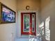 Close-up of the attractive front door with glass detailing and a sidelight at 117 Altesino Ct, Venice, FL 34292