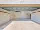 Spacious two-car garage featuring bright lighting, ample storage, and a clean, well-maintained floor at 117 Altesino Ct, Venice, FL 34292
