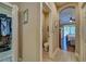 Inviting hallway with bedroom view and access to half bath and closet at 117 Altesino Ct, Venice, FL 34292