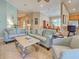 Spacious living room boasts tile floors, light blue accent walls, and comfortable seating at 117 Altesino Ct, Venice, FL 34292