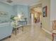 Serene living room with stylish decor, flowing into a hallway, creating an inviting and cohesive living space at 117 Altesino Ct, Venice, FL 34292