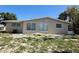 One-story house featuring a well-maintained lawn at 1170 Little Ct, Englewood, FL 34223