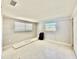 Spacious bedroom with dual windows provides ample natural light at 1170 Little Ct, Englewood, FL 34223