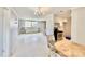 Open-concept living area features kitchen, dining space, and comfortable seating arrangement at 1170 Little Ct, Englewood, FL 34223