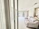 Bright interior featuring a neutral sofa, doorways to other rooms, and lots of light at 1170 Little Ct, Englewood, FL 34223