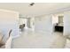Bright, open living area with adjoining dining space and bedroom access showcases the home's layout at 1170 Little Ct, Englewood, FL 34223