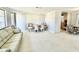 Spacious living room featuring neutral tones and large windows at 1170 Little Ct, Englewood, FL 34223