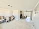 Open living space featuring dining area with unique chair design and bright natural lighting at 1170 Little Ct, Englewood, FL 34223