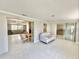 Open-concept living room with bright floors, neutral walls, and connections to other rooms at 1170 Little Ct, Englewood, FL 34223